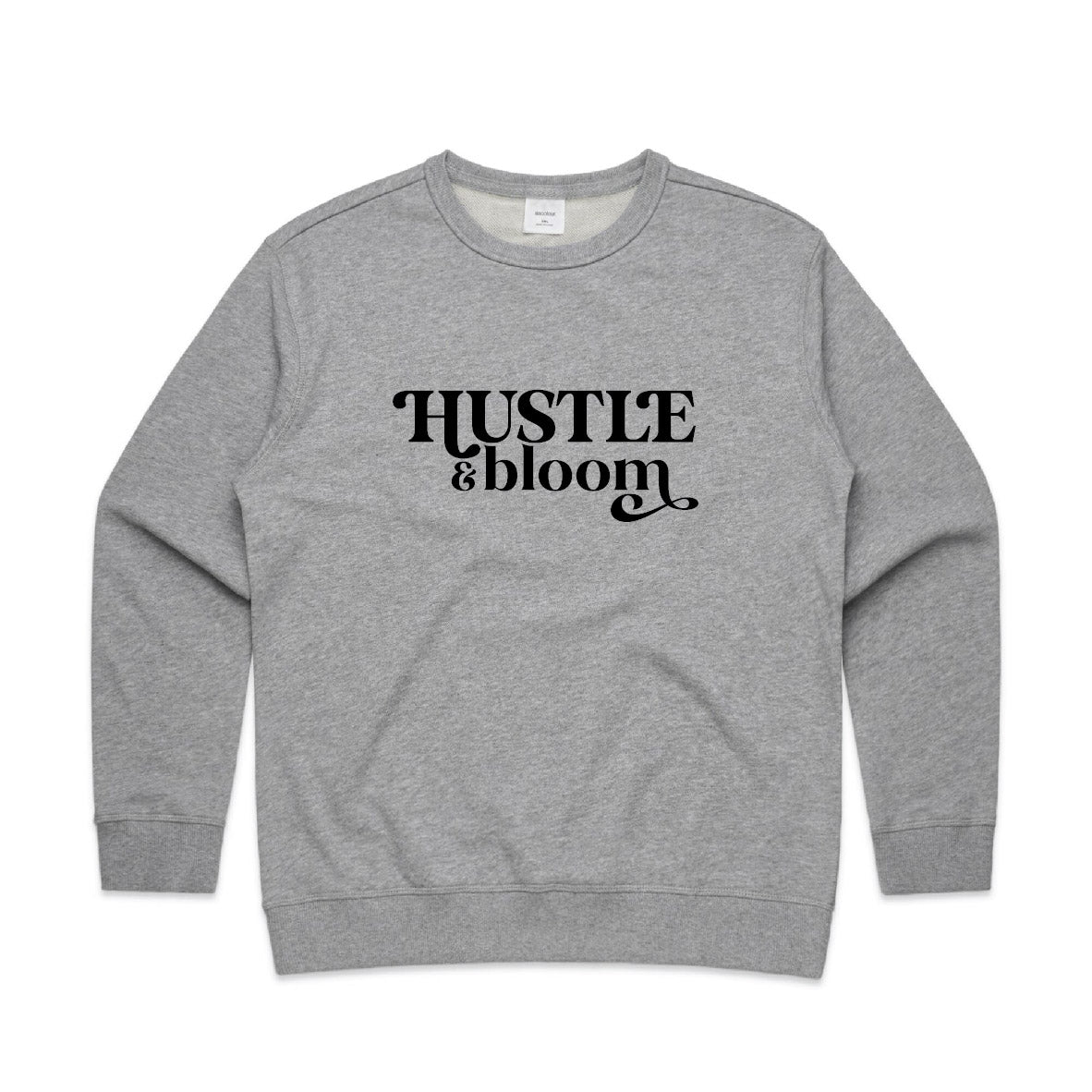 Grey crew neck jumper with black text stating "Hustle and Bloom"